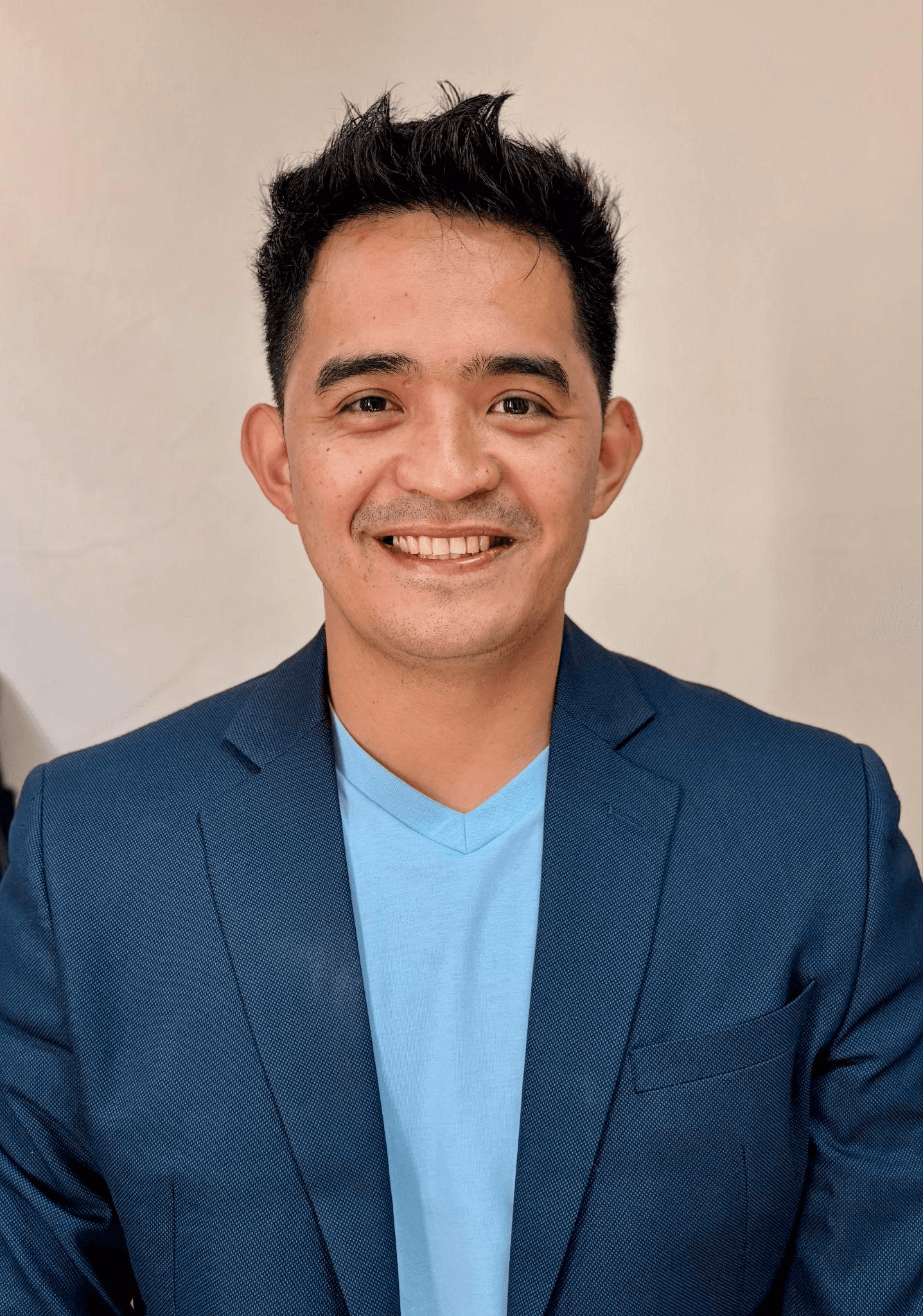 Professional headshot of Ginard S. Guaki